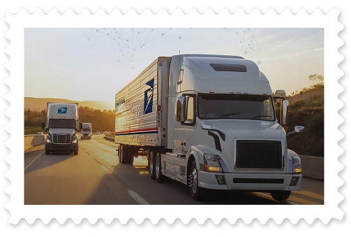 A colorful photograph of three large postal trucks on a highway during sunset.