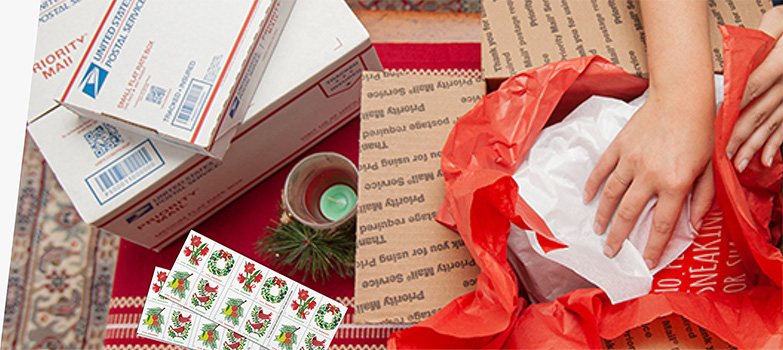 Young woman preparing holiday gifts and Priority Mail boxes to ship for December 25 delivery.