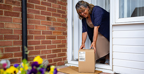 A pile of USPS Ground Advantage packages ready to be shipped.